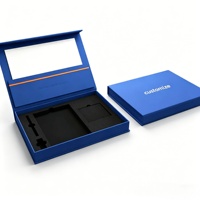 Boîte rigide de luxe bleue mate en forme de livre avec gaufrage et doublure en mousse pour cadeaux d'entreprise et articles promotionnels électroniques