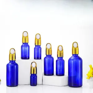 Blue 10ml 30ml 50ml essential oil glass bottle with gold flower basket lid dropper