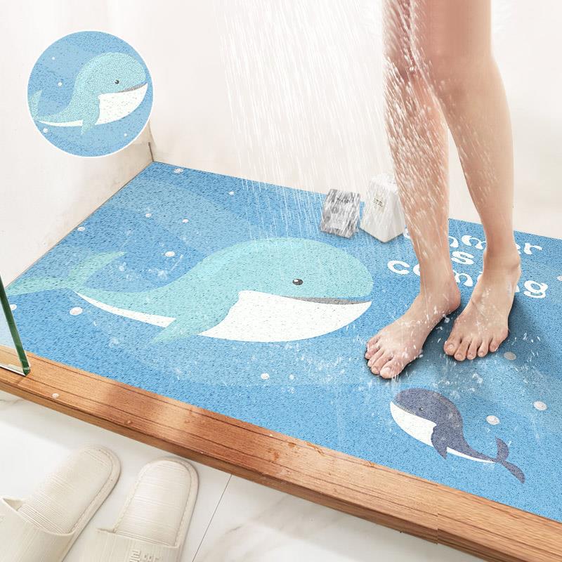 Tapis de bain rond en soie bleu profond, motif baleine.