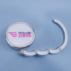 Support <span class=keywords><strong>de</strong></span> sac pliable magnétique en métal personnalisé pour usine OEM avec autocollant époxy « shop with Zubss » en alliage <span class=keywords><strong>de</strong></span> zinc - Product Image 1