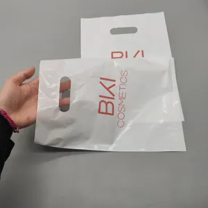 Özel tasarım Logo baskı PE ucuz Die Cut yama kolu/biyolojik olarak parçalanabilir alışveriş taşıma plastik torba