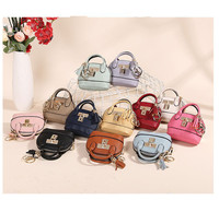 Porte-monnaie ovale mini en cuir de luxe écologique, mignon, avec porte-clés, cadeau de haute qualité pour voiture, vente chaude en gros