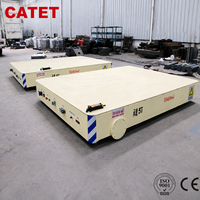 Chariot électrique sans rail pour manutention à plat, capacité de charge de 10 tonnes, conception à braquage flexible, adapté aux passages étroits en atelier