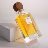 Flacon de parfum en verre transparent rectangulaire minimaliste de 85 ml avec vaporisateur et bouchon en bois, vente en gros personnalisée