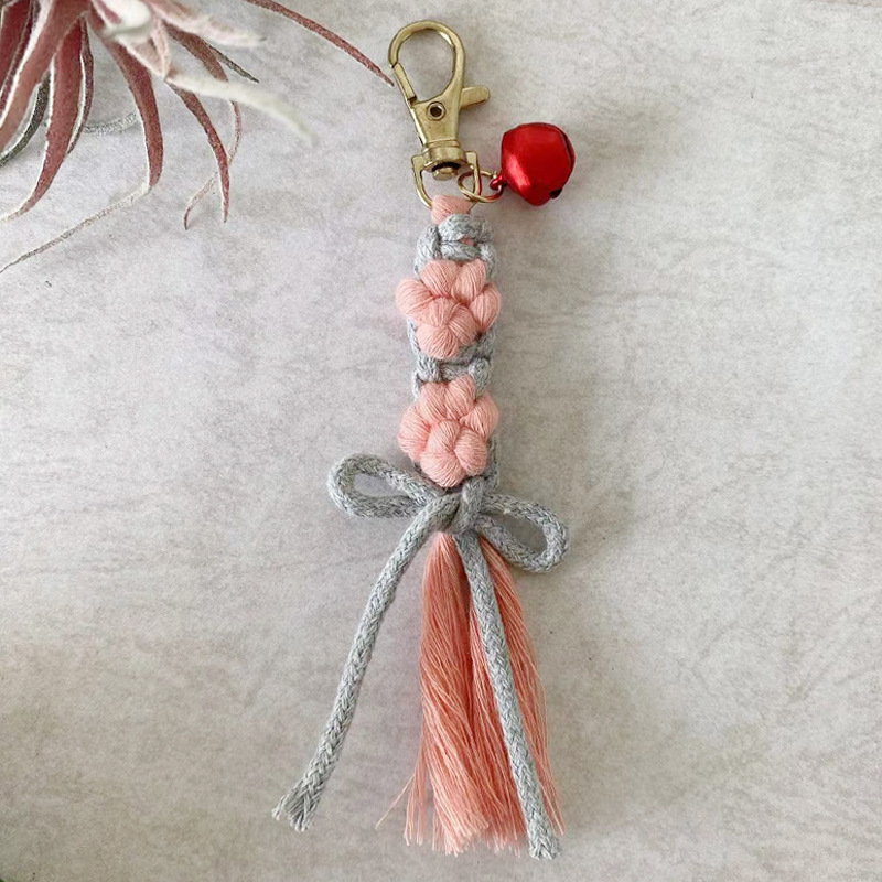 Artiglio di gatto rosa-fiocco grigio chiaro