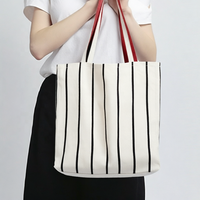 Sac fourre-tout en toile à rayures noires avec logo personnalisé, impression haute visibilité, sac à bandoulière réutilisable pour événements promotionnels et cadeaux d'entreprise