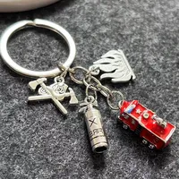 Porte-clés tendance en alliage de zinc en forme de croix de pompier, avec pendentif extincteur, hache et casque de pompier, accessoires pour pompiers