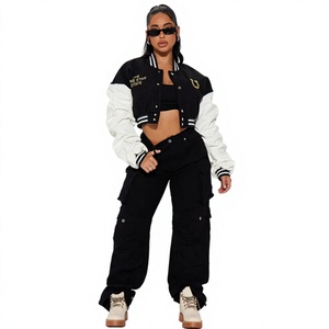 Veste universitaire noire et blanche avec logo brodé, col rabattu, style streetwear, coupe ample, design à simple boutonnage - Product Image 1