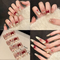 Faux ongles à presser pour femmes, nude, forme cercueil, œil de chat doré, French, danse du lion, nœud, perle rouge, pour le Nouvel An Chinois festif