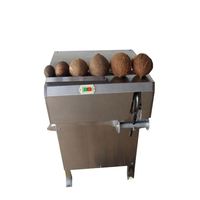Machine à raser et à défibrer la noix de coco décortiquée