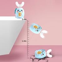 Venta directa OEM 360 ° Cepillo de dientes eléctrico para niños en forma de U para bebés de 2-6-12 años Cerdas suaves de silicona en forma de U