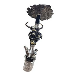 Chicha décorative en métal en forme de tête de taureau, sculpture avec base sculptée et base transparente, pour présentation sur bureau - Product Image 1