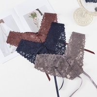 Culotte string taille basse unie pour jeunes femmes, transparente, en dentelle, avec entrejambe en coton, en nylon et élasthanne, brodée, pour l'exportation