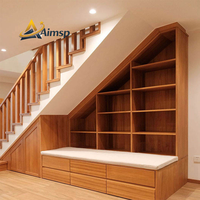 Armoires d'escalier personnalisables au design moderne, idéales pour les solutions de rangement dans les salons et les bureaux