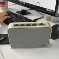 Gran oferta, usado conmutador de red de 10/100Mbps con 2 puertos y 5 puertos de 1/2 Mbps con SNMP QoS para aplicaciones de barra de Internet y cámara IP