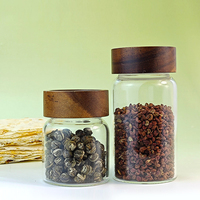 Vente en gros de pots à épices en verre borosilicaté transparent Boîte de stockage hermétique pour biscuits aux épices, thé et céréales avec bouchon à vis en bois d'acacia