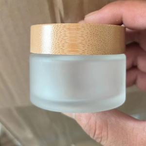 กระปุกแก้วเนยบำรุงผิวแบบฝ้า ขนาด 30 กรัม 50 กรัม 100 กรัม พร้อมฝาเกลียวไม้ไผ่ สำหรับบรรจุลิปบาล์มหรือเครื่องสำอาง - Product Image 1