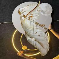 Horloge d'art murale en plumes personnalisée de haute qualité Éclairage LED Décoration murale en céramique de chambre à coucher