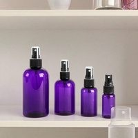 Bouteille ronde en PET violette avec pulvérisateurs à fine brume noirs pour l'emballage de shampooing, de parfum, de lotion, de crème et d'eau