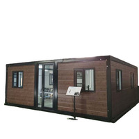 Maison mobile de luxe contemporaine à double aile extensible avec grandes fenêtres et revêtement de sol SPC