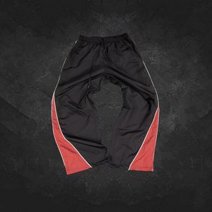 Pantalon de survêtement en polyester à rayures et jambes larges surdimensionné en gros Pantalon de survêtement en nylon pour hommes avec impression de logo personnalisé - Product Image 1