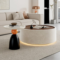 Table basse ronde crème française avec bandes lumineuses, idéale pour les petits salons, hôtels et appartements
