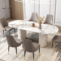 Mobilier moderne de luxe de style italien haut de gamme Base en cuir minimaliste blanc Table à manger ovale à dessus en marbre 8 places