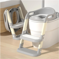 Toilette d'apprentissage de pot à coussin doux avec dossier ergonomique et repose-pieds réglable pour l'apprentissage de la propreté