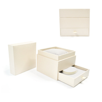 Feuille d'or personnalisée de haute qualité et estampage boîte à bijoux en papier rigide boîtes d'emballage en velours avec oreiller cadeau en carton pour montre