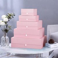Boîte magnétique rigide pliable rose personnalisée avec languette à ruban pour l'emballage de parfums/vêtements/cadeaux/produits de beauté par Shenzhen HTD Packaging