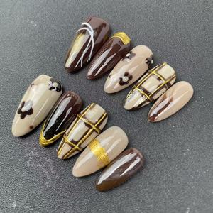 <span class=keywords><strong>Uñas</strong></span> Postizas Hechas a Mano de Alta Calidad al por Mayor, Forma de Almendra, <span class=keywords><strong>Color</strong></span> Café, Estilo Pintado a Mano, Reutilizables - Product Image 1