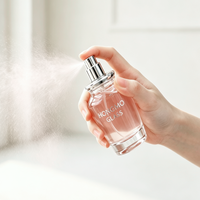 Flacon de parfum vaporisateur à fine brume de luxe 50 ml, forme ronde élégante, couvercle rose, flacon de parfum en verre avec logo personnalisé