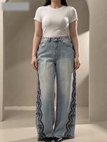Jean large taille haute pour femme avec strass scintillants et broderie en dentelle sur les côtés, disponible en deux couleurs, commande en gros