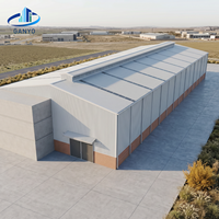 Edificio de Almacén Prefabricado de Acero con Estructura Metálica de Gran Vano, Paneles de Pared Metálicos y Puertas de Acceso Industriales