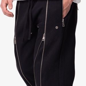 Pantalon de survêtement évasé pour homme avec fermeture éclair latérale intégrale, décorations à rivets et cordon de serrage, style streetwear, personnalisable OEM - Product Image 3