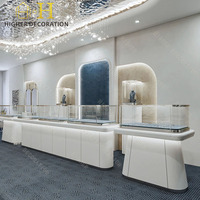 Comptoir de présentation de bijoux en verre ultra-transparent et acier inoxydable de luxe, mobilier de présentation de bijoux sur mesure pour la conception de bijouterie