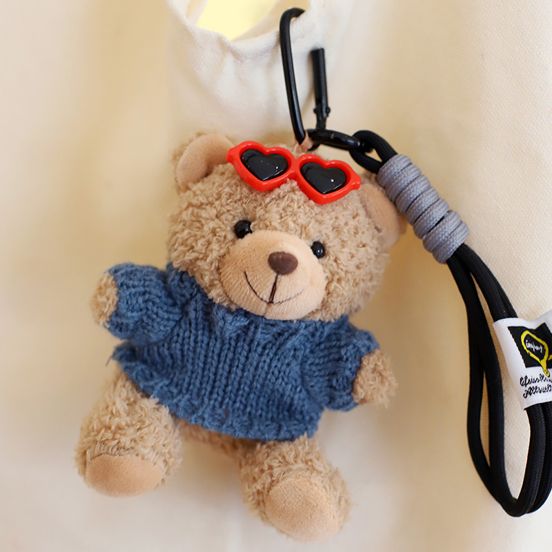 Blue sweater-light brown bear hand rope