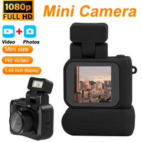Cámara Infantil Compacta Mini HD 1080P CMOS con Pantalla de 1.44 Pulgadas, Gran Angular de 90°, Memoria Integrada de 512 GB, Base de Carga, Lámpara Flash, Portátil