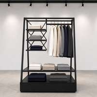 Présentoir de vêtements en métal noir en forme de A avec tringle de suspension, étagères et tiroir – Fixation de vente au détail haut de gamme