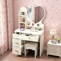 Coiffeuse moderne rose en bois avec miroir en forme de cœur, tiroirs et tabouret pour hôtel et salon