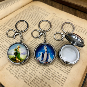 Caja de almacenamiento redonda de Metal para llaveros, con tapa de cristal, colgante con imagen religiosa, estuche portátil para joyería, para regalo - Product Image 1