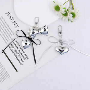Nouveau Creative Simple Design Résine Argent Bowknot 3D Coeur Alliage Porte-clés Sac Pendentif Ornement - Product Image 1