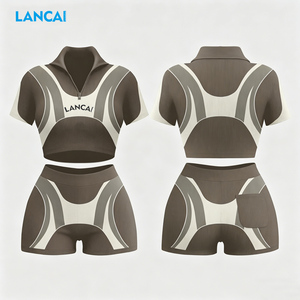Ensemble 2 pièces côtelé pour femme : Haut polo semi-zippé et short cycliste taille haute – Tenue de sport respirante en coton écoresponsable - Product Image 1