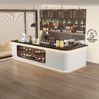 Comptoir de réception moderne et écologique en forme de L, blanc et en cuir, pour café de centre commercial, avec vitrine à pâtisserie