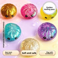 Jouets à presser écologiques en TPR 2026 – Jouets anti-stress en forme de boulettes de raviolis vapeur avec visage souriant