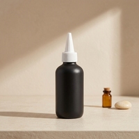 Bouteille souple personnalisée en LDPE noir de 120 ml (4 oz) avec col 24/410, finition mate ou brillante, avec bouchon applicateur pour huile capillaire et coloration