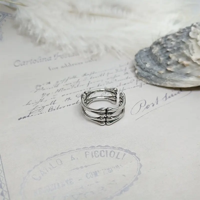 แหวนกระดูกผูกสีดำสุดสร้างสรรค์แหวนแนวพังก์ปรับได้สำหรับผู้ชายและผู้หญิง