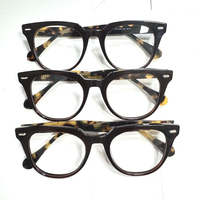 Vente en gros des dernières montures de lunettes optiques classiques rétro à rivets en acétate de couleur unie, avec différentes couleurs, unisexe