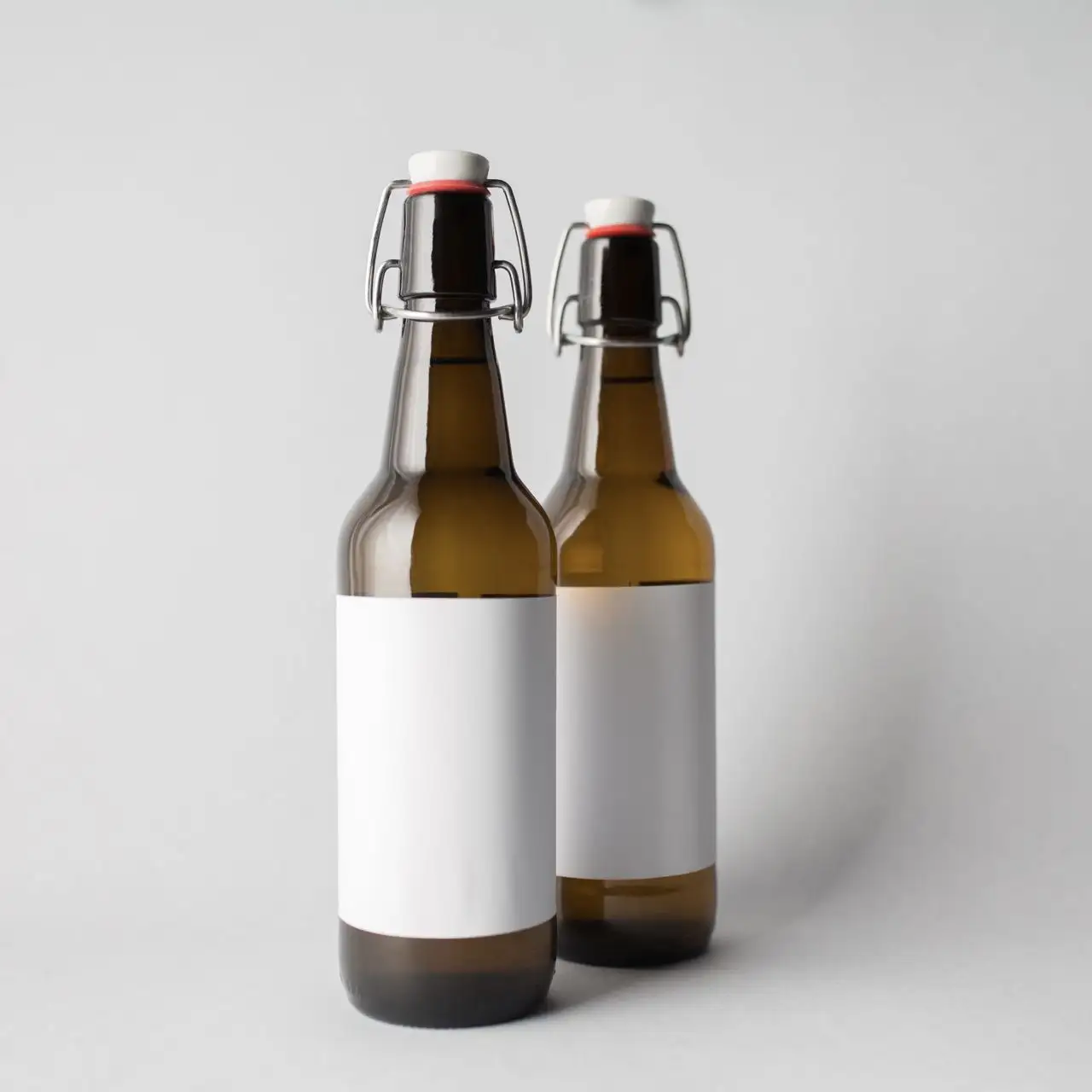 ホットセールカスタムラベル330ml500mlフリップスイングトップ琥珀色ガラスビール瓶ガラススパークリングワインアルコールジュース飲料ボトル