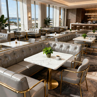 Table à manger dorée en marbre sur mesure pour hall d'hôtel chaise canapé mobilier de restaurant moderne ensemble de sièges de stand pour café café